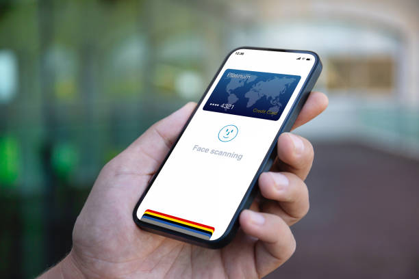 istock man hand hold phone with face scanning id on screen 2106332390