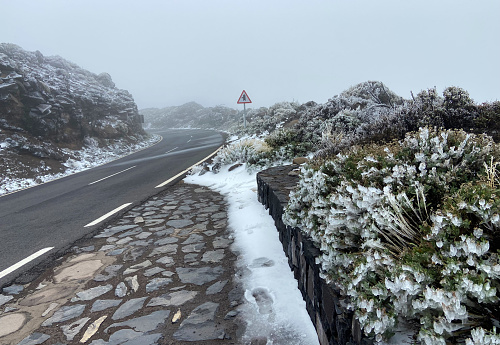 Road through Teide National Park near Izana on a cold winter day.Travel concept.Selective focus.