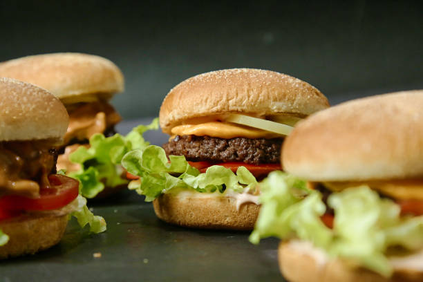 istock Group of Hamburgers Arranged on Table 2106353849