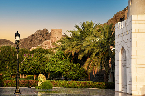 Al Masmak Fort  exterior view with Saudi Arabia flag and palm trees