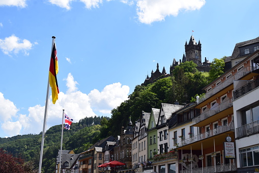 Cochem, Germany - 06/23/2022: waterfront Cochem with the castle above