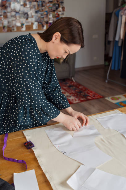 istock Fashion designer working on a new clothing pattern 2106451081