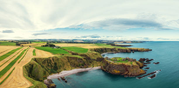 Aberdeenshire, Scotland, UK - October 4th of 2023 Old ruined castle in Scotland Dunnottar. this ancient fortress is a stunning medieval stronghold located on a rocky headland on the northeastern coast of Scotland, near Stonehaven. The ruins that remain today mainly date back to the 15th and 16th centuries, but the site’s history as a fortified location stretches back to the Early Middle Ages