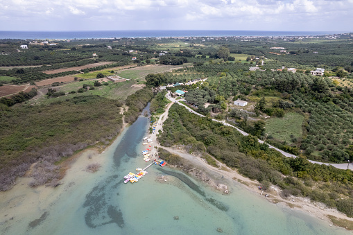 Aerial view of calm bay and marina with boats moored, Lake Kournas