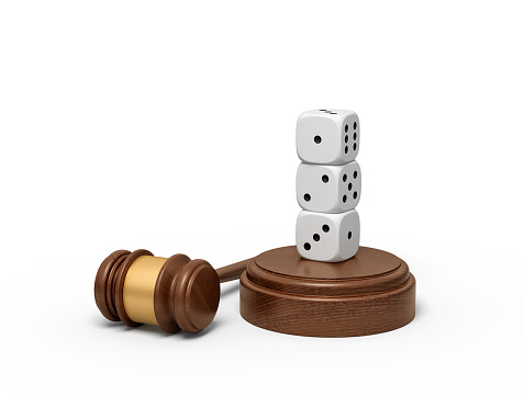 3d rendering of three white dice standing on top of each other on sounding block with gavel lying beside. Pronounce sentence. Rely on luck. Fate is at stake.