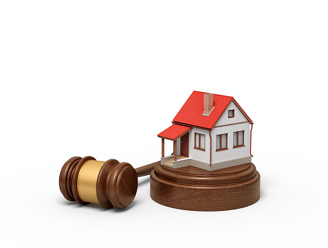 3d rendering of small white house with red roof on round wooden block and brown wooden gavel. Home and mortgage. Digital art. Private property.