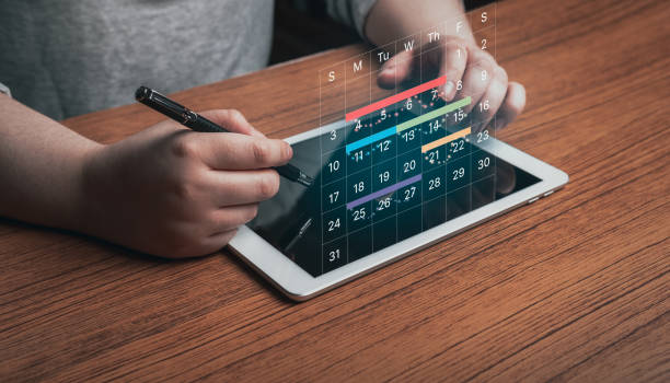 Businesswoman managing her business schedule. Setting reminders and appointments concept. Planning ideas.