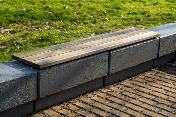 istock modern wooden and concrete bench in the park 2106651123
