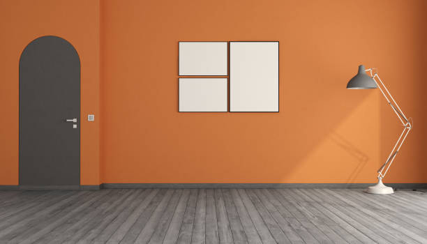 istock Empty room with orange walls and arched frameless door 2106662402