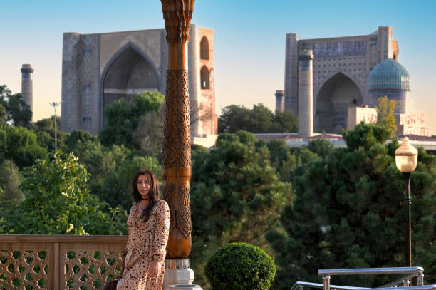 istock lady posing in front of the Bibi-Khanym Mosque, Samarkand, Uzbekistan 2106662405