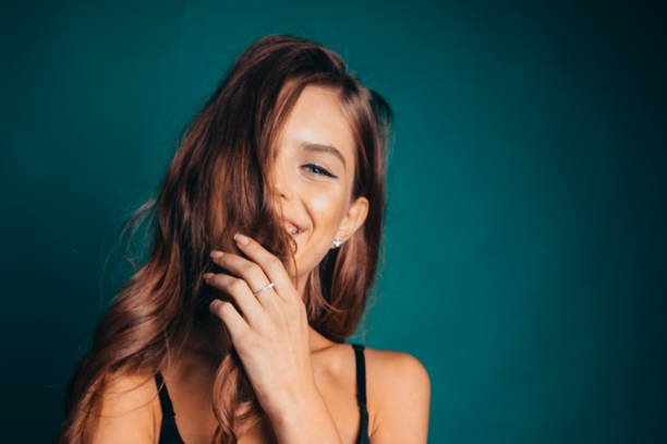 istock Young woman with a beautiful smile and braces on her teeth 2106662863