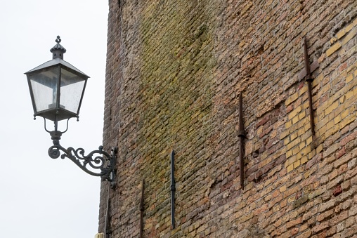old street lamp on brick wall