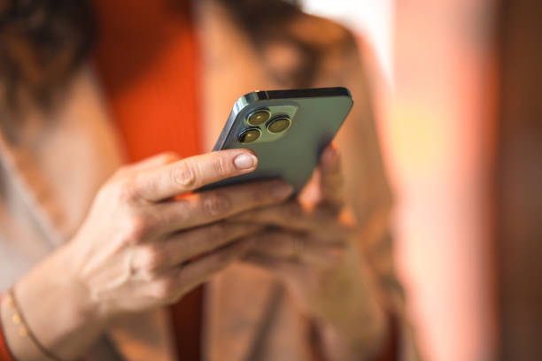 istock Caucasian Female Professional Using Smartphone in Office 2106685422
