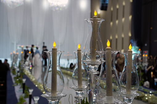 Wedding table decoration with candles in the shape of a heart