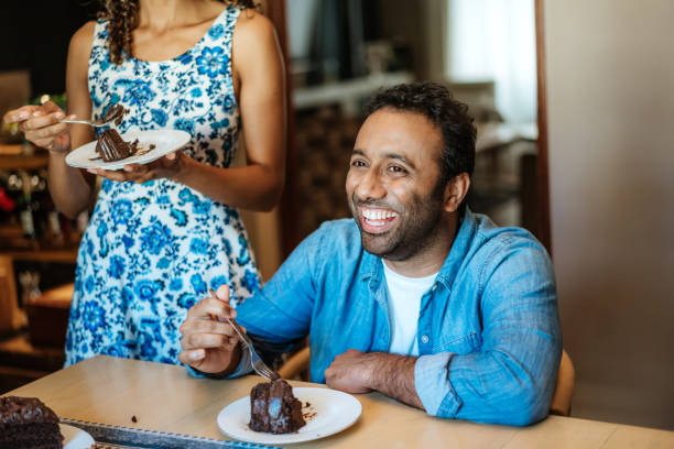 istock Enjoying Delicious Chocolate Cake at Home 2106699171