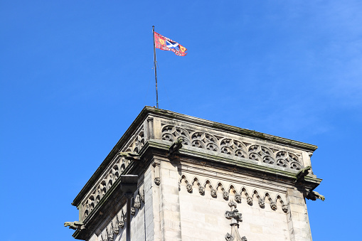 Scottish flag flying on old tower of  Brewdog restaurant, Chamber Building . Panmure Street, Dundee, Scotland