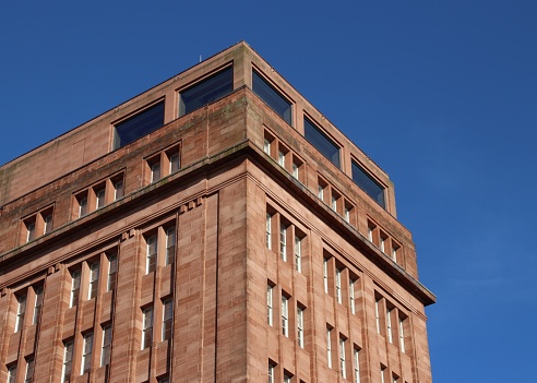 Red-coloured tower of DC Thomson Meadowside building, Albert Square, Dundee