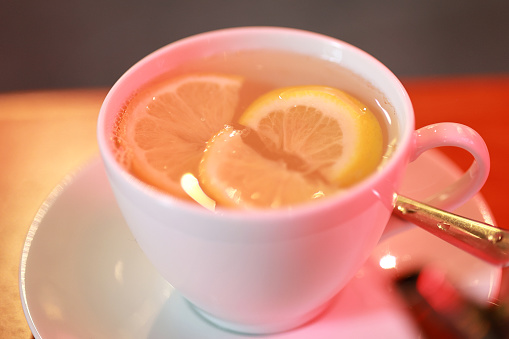 Lemon tea with honey is a refreshing beverage made by combining brewed tea with lemon juice and honey for a citrusy and sweet flavor.