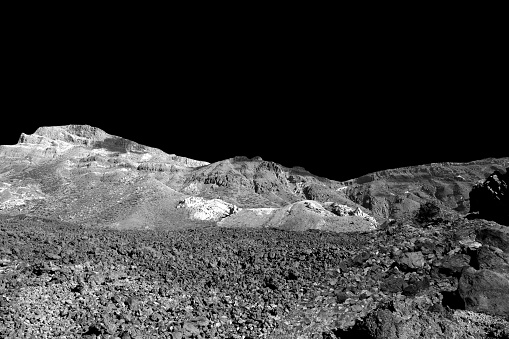 Space landscape.  Cosmic scene with craters, stone, sand and black sky. Moon