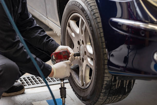 istock Brake pad replacement and maintenance mechanic 2106796387