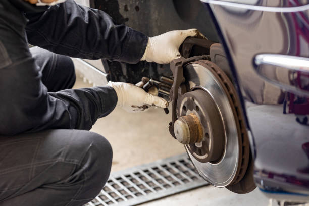 istock Brake pad replacement and maintenance mechanic 2106796918