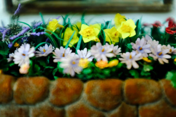 Close-up of the little artificial flowers. Artificial flower scene for decoration, art craft or display. Flower and plant.