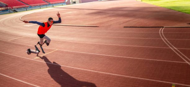 Female coach and group of jumping children at the stadium. School gym trainings or athletics