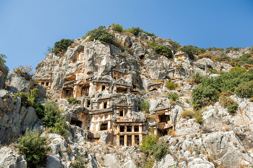 Ruins of old lycian rock tombs in ancient Myra city near town Demre, Antalya province, Turkey