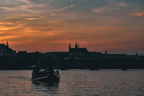 Boat on the Vltava river Prague at dusk