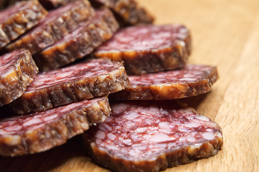 Heap of sliced sausage, macrophoto. Lots of sausage slices.