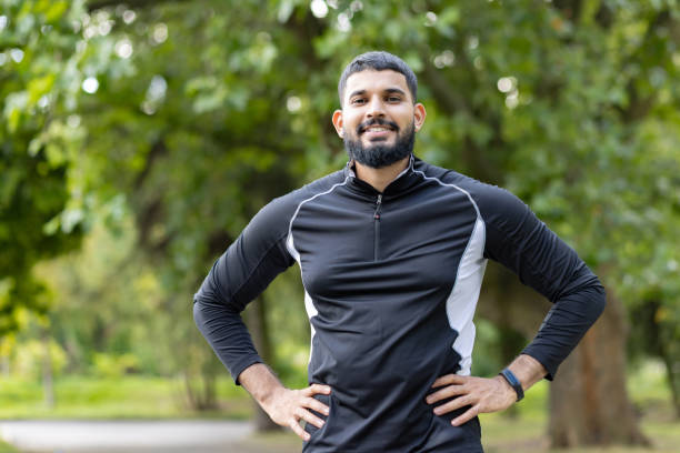 istock Confident athlete taking a break in the park 2106850229