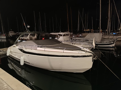 Set of parked boats at night in a Pier in Menorca