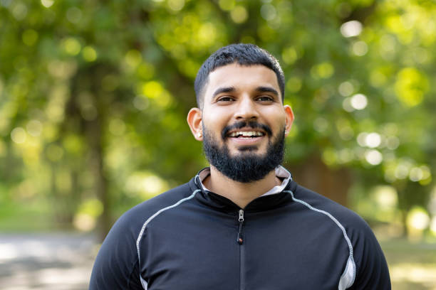 istock Man in athletic wear enjoying a peaceful park 2106857785