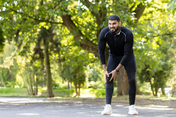 istock Athlete experiencing knee pain during outdoor workout 2106861071