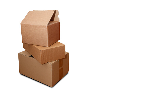 Stacked cardboard boxes on white background. Online Shopping or delivery theme.