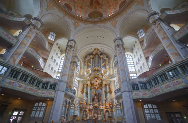 The baroque Frauenkirch (church of our lady) ornate interior with the altar and the pipe organ, Dresden, Saxony, Germany.