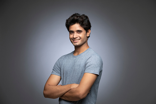 Portrait of Young Indian Isolate over Grey Background.