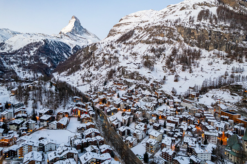 Aerial view of snow covered, Swiss mountain village in winter