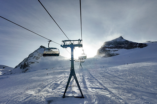 Base of a mountain covered in snow light up in the bright sun. Jungfrau is the Top of Europe and destination for tourists coming to Switzerland