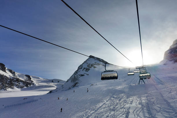 istock Snowcapped mountains and chairlift 2106896793