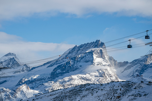Gondola lift at ski resort in winter. Pirin Mountains. Ropeway station in Bansko