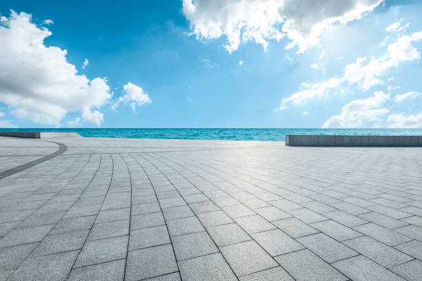 istock Empty square floor and blue sea with sky clouds background 2106903739