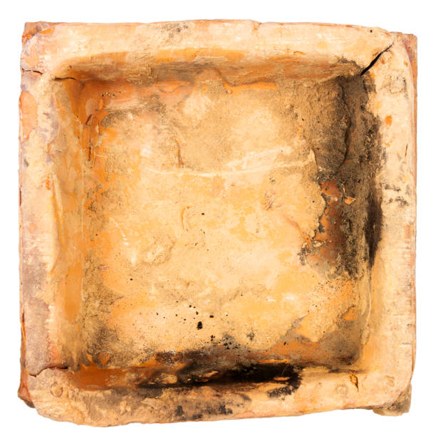 istock Old furnace tile isolated on white background 2106906411
