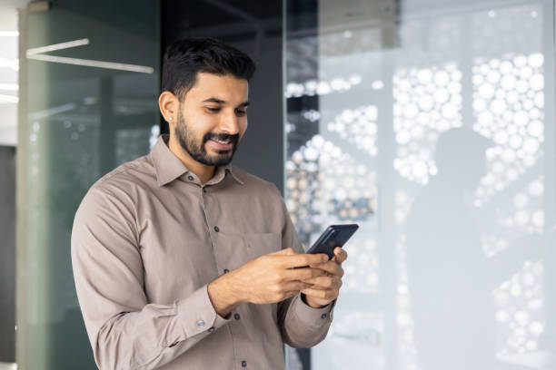 istock Professional businessman using smartphone in modern office environment 2106917226