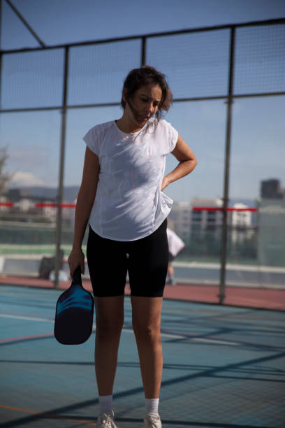 istock Young Female Pickleball Player Tired During Match 2106926158