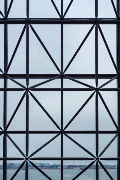 istock Truss Behind Glass Curtain Wall 2106940070