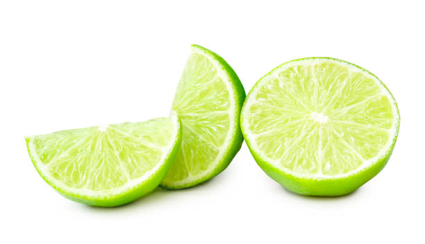 istock Front view of fresh green lemon half with slices or quarters isolated on white background with clipping path 2106954620