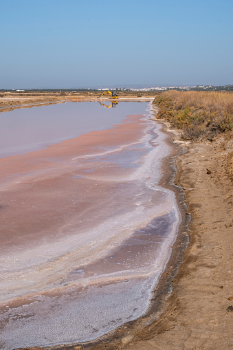 Piles of salt in the salt flats of Iptuci in Prado del Rey, Cadiz province, Andalusia, Spain. Settling ponds for salt production by evaporation.