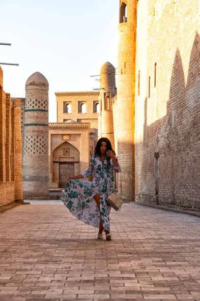 istock Khiva, a lady walking around the old city 2106993748
