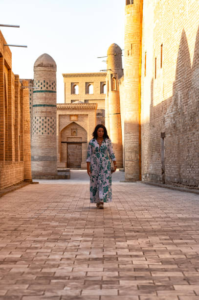 istock Khiva, a lady walking around the old city 2106994815